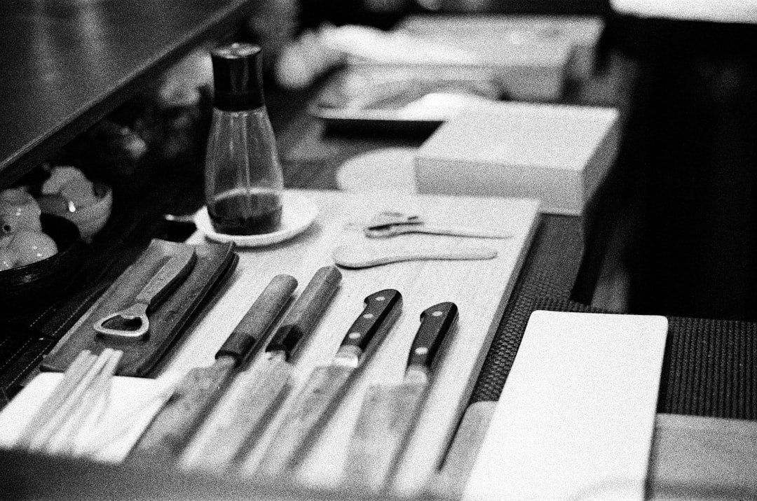 Professional eyebrow studio setup with lamination tools and tinting products arranged neatly on a clean, modern workstation